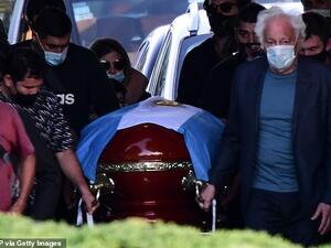 He died in his sleep at noon while resting at his home in Tigre, Buenos Aires, Argentina, on Wednesday. Pictured, Maradona's coffin. (AFP)