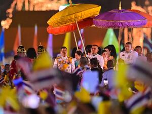 Thailand's King Maha Vajiralongkorn (C) looks at royalist supporters during a ceremony to commemorate the birthday of his father the late Thai king Bhumibol Adulyadej at Sanam Luang in Bangkok on December 5, 2020. Lillian SUWANRUMPHA / AFP