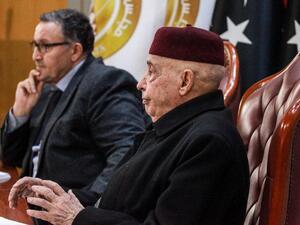 Aguila Saleh Issa (R), speaker of the Tobruk-based Libyan House of Representatives, meets with Ali al-Habri, governor of the parallel Central Bank of Libya based in the east, and with other officials in eastern Benghazi on December 6, 2020. Abdullah DOMA / AFP