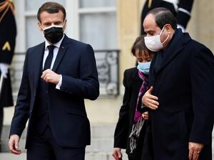 French President Emmanuel Macron (L) escorts his Egyptian counterpart Abdel Fattah al-Sisi (R) out of the Elysee presidential Palace on December 7, 2020 in Paris, after a meeting as part of al-Sisi's three-day state visit to France. Bertrand GUAY / AFP