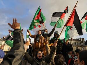 Supporters of Western Sahara's independence hold Western Sahara and Algerian flags during a demonstration, in Bordeaux, southwestern France on December 12, 2020. Algeria, Morocco's neighbour and regional rival, is the key foreign backer of the Polisario Front, which has campaigned for independence for Western Sahara since the 1970s. thibaud MORITZ / AFP Supporters of Western Sahara's independence hold Western Sahara and Algerian flags during a demonstration, in Bordeaux, southwestern France on December 12, 2020. Algeria, Morocco's neighbour and regional rival, is the key foreign backer of the Polisario Front, which has campaigned for independence for Western Sahara since the 1970s. thibaud MORITZ / AFP
