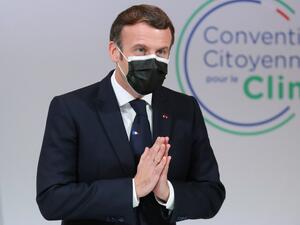 French President Emmanuel Macron gestures as he attends a meeting with members of the Citizens' Convention on Climate (CCC) about their proposals to fight against global warming, in Paris on December 14, 2020. Thibault Camus / POOL / AFP