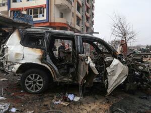 A damaged vehicle is seen at the site of a car bomb attack, in Kabul on December 20, 2020. A car bomb killed eight people and wounded more than 15 others in Kabul on December 20, officials said, the latest attack to rock the Afghan capital. Zakeria HASHIMI / AFP
