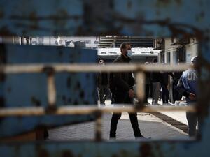 Palestinians wait to recive food rations outside an aid distribution center run by the United Nations Relief and Works Agency (UNRWA) at the al-Shati camp for Palestinian refugees in Gaza City on December 12, 2020. Mohammed ABED / AFP