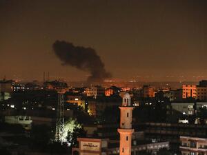 Smoke and flames are seen following an Israeli air strike in Gaza city, on December 26, 2020. MAHMUD HAMS / AFP