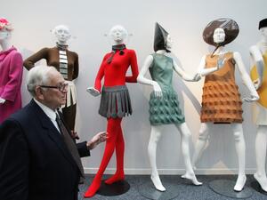This file photo taken on November 9, 2006 shows French designer Pierre Cardin posing with his new fashion space, in Saint-Ouen. French fashion designer Pierre Cardin, hailed for his visionary creations but also for bringing stylish clothes to the masses, died on December 29, 2020 aged 98, his family told AFP. Cardin who was born in Italy in 1922 but emigrated to France as a small child, died in a hospital in Neuilly in the west of Paris, his family said. FRANCOIS GUILLOT / AFP