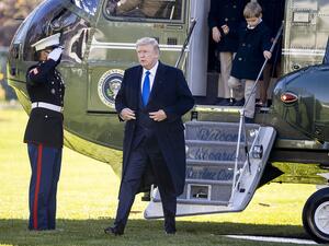U.S. President Donald Trump, followed by his grandchildren, Arabella Kushner, Theodore Kushner, and Joseph Kushner get off Marine One on the south lawn of the White House on November 29, 2020 in Washington, DC. President Trump spent the weekend at Camp David and at Trump National Golf Club in Sterling, Virginia. Tasos Katopodis/Getty Images/AFP