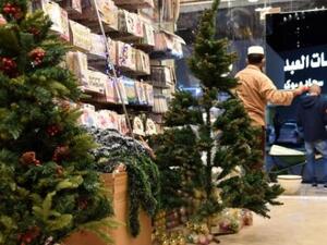 Expats living in Saudi Arabia choose Christmas decorations at a gift shop in the capital Riyadh on December 7, 2020. For decades, Christmas sales were largely underground, and Christians from the Philippines, Lebanon and other countries celebrated behind closed doors or in expat enclaves. (AFP)