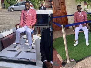 Che's body was filmed sitting outside the church next to a large photo of him. (Twitter)