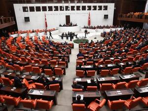 Turkish MPs and ministers attend a debate in Ankara on 1 October (AFP)