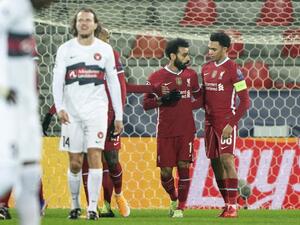 Liverpool's Mohamed Salah (2ndR) celebrates scoring the opening goal with his teammates during the UEFA Champions League Group D football match against FC Midtjylland (Photo: AFP)