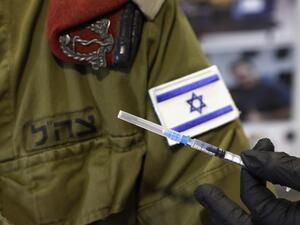 An Israeli military medic prepares to administer the Pfizer-BioNTech COVID-19 vaccine at the medical centre of Tzrifin military base in the Israeli town of Rishon Lezion on December 28, 2020. JACK GUEZ / AFP