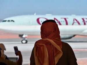 Journalists watch the arrival of the Qatar envoy ahead of the 41st Gulf Cooperation Council (GCC) summit in the city of al-Ula in northwestern Saudi Arabia on January 5, 2021. 