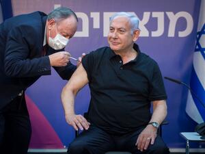 Israeli Prime Minister Minister Benjamin Netanyahu receives the second dose of the coronavirus disease (COVID-19) vaccine at Sheba Medical Center in Ramat Gan, near the coastal city of Tel Aviv, on January 9, 2021. Miriam ALSTER / POOL / AFP