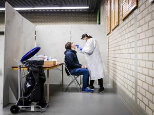 A resident of the Lansingerland municipality gets tested for the Covid-19 in Bergschenhoek, on January 13, 2021, as the UK variant of the disease has been detected. Remko de Waal / ANP / AFP