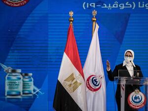 Egyptian Health Minister Hala Zayed gives a press conference, in a tent set up outside the Abou Khalifa hospital, in Ismailia, about 120kms east the capital Cairo, on January 24, 2021. Egypt began its nationwide Covid-19 immunisation program today, with a doctor and a nurse receiving the Chinese-made Sinopharm jab. Khaled DESOUKI / AFP