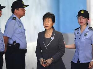 South Korea’s ousted president Park Geun-Hye arrives at the Seoul Central District Court in Seoul on Aug. 7, 2017 for her trial over the massive corruption scandal that led to her downfall. Jung Yeon-Je | AFP | Getty Images