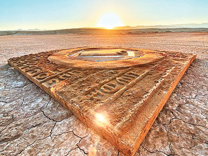 The GCC logo appears at the center of the piece surrounded by inscriptions resembling the rock art and carvings of the Lihyan civilization. (Instagram)