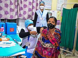Health officials and a volunteer take part in a dry run, also known as a mock drill, for the Covid-19 vaccine delivery at a health centre in New Delhi, India, on January 2. (AFP)