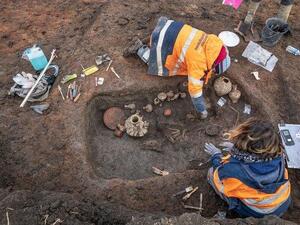French archeologists dig at an ancient child burial site recent at the Clermont-Ferrand Airport. France's National Institute of Preventive Archaeological Research said Thursday the site dates back 2,000 years. (Photo courtesy of National Institute of Preventive Archaeological Research Twitter)