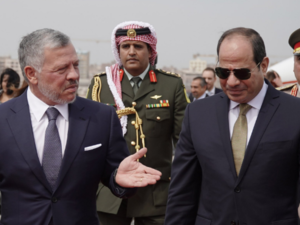 Egyptian President Abdel Fattah El-Sisi, right, is met by Jordan’s King Abdullah on his arrival in Amman. (Twitter/@RHCJO)