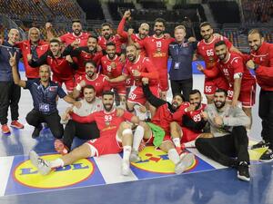 Bahrain's players pose for a photo as they celebrate after winning the 2021 World Men's Handball Championship match between Group D teams Bahrain and DR Congo at the Cairo Stadium Sports Hall in the Egyptian capital on Jan 19, 2021. (Photo: AFP)