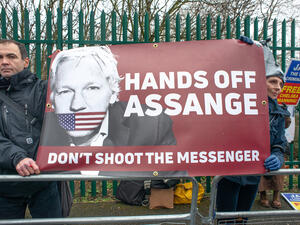 Protesters gather outside Belmarsh Prison, in support of the Free Julian Assange Campaign on the day of the WikiLeaks founder's extradition to the USA court hearing. (Shutterstock/ File Photo)