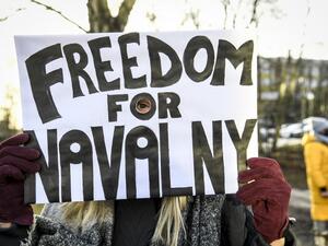 A demonstrator demanding the release of the detained Russian opposition leader Alexei Navalny holds a placard outside the Russian embassy in Stockholm, Sweden, on January 23, 2021. The 44-year-old Chief Kremlin critic Alexei Navalny was arrested at his return in Moscow after spending several months in Germany recovering from a poisoning attack that he said was carried out on the orders of President Vladimir Putin Fredrik SANDBERG / TT News Agency / AFP