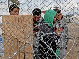 Asylum seekers staying in the Pournara temporary accommodation centre protest over delays in their application process and what they described as the inhumane living conditions in the camp, in Kokkinotrimithia, some 20 kilometres outside the Cypriot capital Nicosia, on February 1, 2021. Due to the closure of other migration routes to Europe, asylum applications have increased sixfold over the last five years in Cyprus -- a country of fewer than one million inhabitants -- from 2,265 in 2015 to 13,650 in 2019