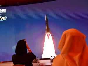This file photo taken on July 19, 2020, shows a screen broadcasting the launch of the "Hope" Mars probe at the Mohammed Bin Rashid Space Centre in Dubai. The first Arab interplanetary mission is expected to reach Mars' orbit on February 9, 2021, in what is considered the most critical part of the journey to unravel the secrets of weather on the Red Planet. The unmanned probe -- named "Al-Amal" -- Arabic for "Hope" -- blasted off from Japan last year, marking the next step in the United Arab Emirates' ambiti