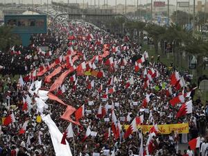In this file photo taken on February 25, 2011 Bahraini Shiite anti-government protesters chant slogans against the regime during a rally in remembrance of the seven people who were killed in police crackdowns as they march towards Pearl Square in Manama. With a popular, reform-minded crown prince newly installed as prime minister, and a decade passed since the Arab Spring, Bahrain should be well placed to cast off the painful legacy of its uprising. The Pearl monument in downtown Manama -- the centre of the protests before they were crushed with the help of Saudi forces -- has long since been razed. But the nation's wounds remain raw and there is still no room for dissent.  Joseph EID / AFP In this file photo taken on February 25, 2011 Bahraini Shiite anti-government protesters chant slogans against the regime during a rally in remembrance of the seven people who were killed in police crackdowns as they march towards Pearl Square in Manama. With a popular, reform-minded crown prince newly installed as prime minister, and a decade passed since the Arab Spring, Bahrain should be well placed to cast off the painful legacy of its uprising. The Pearl monument in downtown Manama -- the centre of the