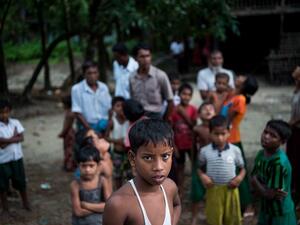 In this file photo taken on September 27, 2017, Rohingya Muslims gather at Pan Taw Pyin village in Maungdaw in Myanmar's northern Rakhine state. Myanmar's stateless, conflict-scarred Rohingya community are on edge with the return of military rule, fearing further violence in a restive part of the country where others have shown support for the new regime. STR / AFP