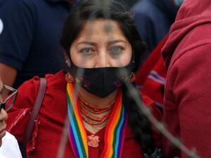 A supporter of the Ecuadorian presidential candidate Yaku Perez takes part on a demonstration in front of the National Electoral Council (CNE), where Perez and his competitor Guillermo Lasso held a meeting with members of the CNE and the OAS, in Quito, on February 12, 2021. Former right-wing banker Guillermo Lasso and left-wing indigenous leader Yaku Perez, who are vying for the second place for Ecuador's presidential run-off election, agreed on February 12 at the Electoral Council to request a recount of v
