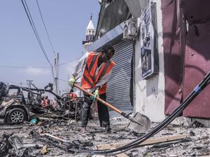 A rescue worker clears debris with a shovel at the site of a suicide car bombing attack near a security checkpoint in Mogadishu on February 13, 2021. Three people were killed and eight wounded after a car bomb detonated near a security checkpoint in the Somali capital Mogadishu, a security official and witnesses said. Abdirazak Hussein FARAH / AFP A rescue worker clears debris with a shovel at the site of a suicide car bombing attack near a security checkpoint in Mogadishu on February 13, 2021. Three people were killed and eight wounded after a car bomb detonated near a security checkpoint in the Somali capital Mogadishu, a security official and witnesses said. Abdirazak Hussein FARAH / AFP