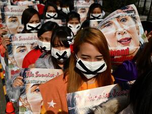 Activists take part in a protest against the military coup in Myanmar in Tokyo on February 14, 2021. CHARLY TRIBALLEAU / AFP Activists take part in a protest against the military coup in Myanmar in Tokyo on February 14, 2021. CHARLY TRIBALLEAU / AFP