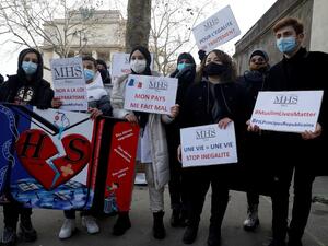 Protesters demonstrate against a bill dubbed as "anti-separatism", in Paris on February 14, 2021. French lawmakers a few weeks ago began debating a controversial bill against what the interior minister described as the "disease" of Islamist extremism eating away at the country's unity. President Emmanuel Macron has pushed for the legislation, which would tighten rules on issues ranging from religious-based education to polygamy, since a spate of attacks blamed on extremists late last year. GEOFFROY VAN DER 