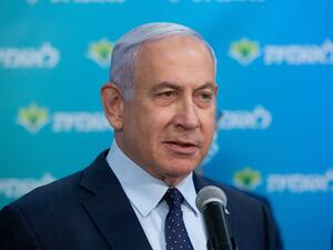 Israeli Prime Minister Netanyahu attends a ceremony marking the 4,000,000th person to be vaccinated at Leumit Health Care Services vaccination facility in Jerusalem on February 16, 2021. Israel's largest healthcare provider said a study of more than half a million fully vaccinated Israelis indicated the Pfizer/BioNTech jab gave 94 percent protection against Covid-19. Alex KOLOMIENSKY / POOL / AFP