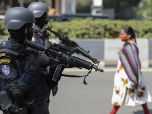 Organisation for Counter Terrorist Operations (OCTOPUS) special police unit commandos stand guard during a security drill in Hyderabad on February 24, 2021. NOAH SEELAM / AFP