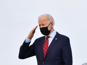 US President Joe Biden salutes as he boards Air Force One before departing from Andrews Air Force Base in Maryland on February 27, 2021. The Bidens travel to Wilmington, Delaware, to spend the weekend. MANDEL NGAN / AFP