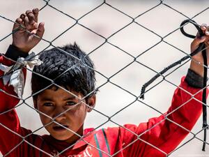 A Syrian child looks on in the Al-Hol camp in Syria, on 8 August 2019 pDELIL SOULEIMAN/AFP/Getty Images]