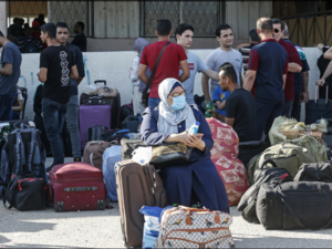 Hundreds of Gazans assembled before dawn in the waiting area. [Said Khatib/AFP]
