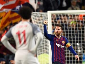 The Bundesliga giants' CEO thinks the Egyptian icon is comparable to the Barcelona star in terms of his accomplishments on the pitch (Photo: AFP)