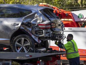A tow truck operator secures the car that golf legend Tiger Woods was driving when seriously injured in a rollover accident on February 23, 2021 in Rolling Hills Estates, California. (Photo: AFP)
