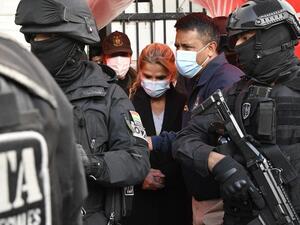 Former interim Bolivia's President Jeannine Anez (C)