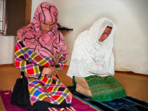 Two transgender women praying