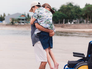 Halil Sahin carries 10-year-old disabled son to school on his back