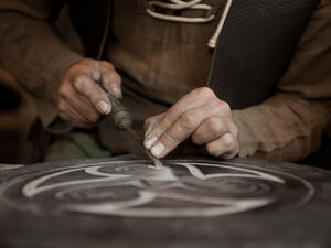 Craftsman working on stone 