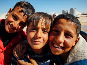 Syrian children pose for the camera at the Zaatari refugee camp in Mafraq, Jordan
