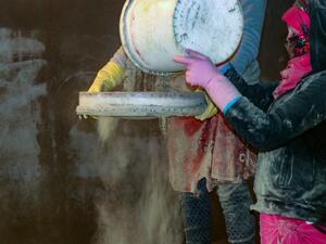 Women sifts dried cannabis to prepare hashish in eastern Lebanon