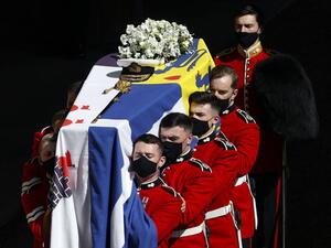 The coffin of Britain's Prince Philip, Duke of Edinburgh is laid onto a modified Land Rover Defender 